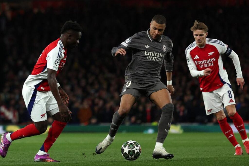 Jogadores de Real Madrid e Arsenal - Champions League 2025/26